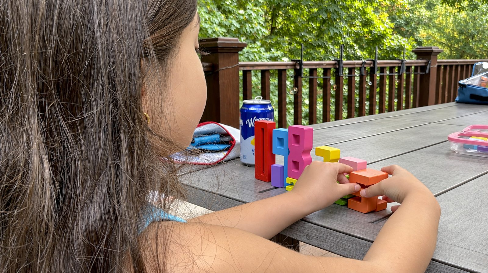 Student building numbers with foam manipulatives